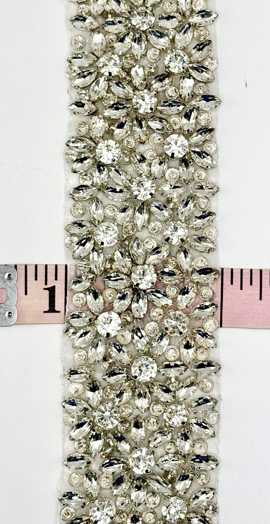 Ariel Rhinestone trim with silver setting and intricate design, 2 inches wide.