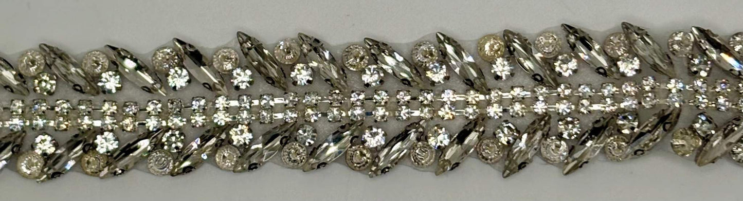 Handmade clear rhinestone bridal belt on silver background.