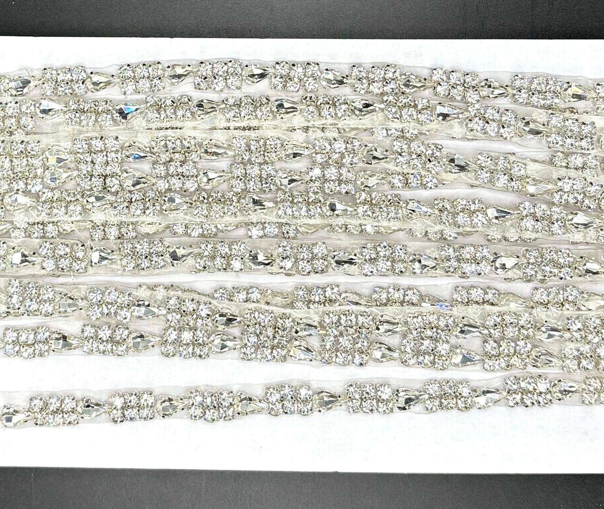 Simply Stunning Yardage rhinestone trim with sparkling stones in various colors, ideal for embellishments.