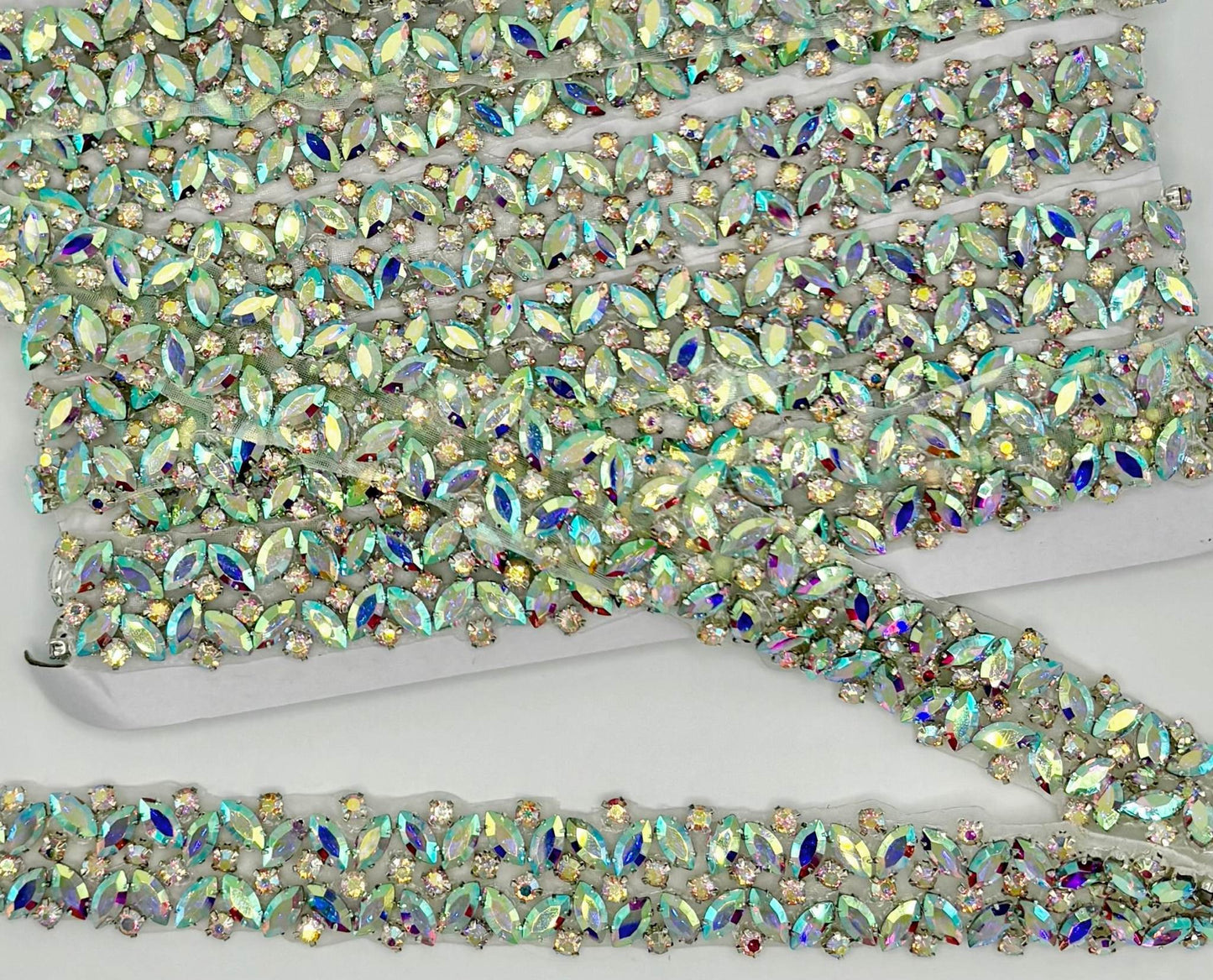 Handmade Rhinestone trim Yardage approximately 7/8 inch wide, featuring intricate, colorful stones.