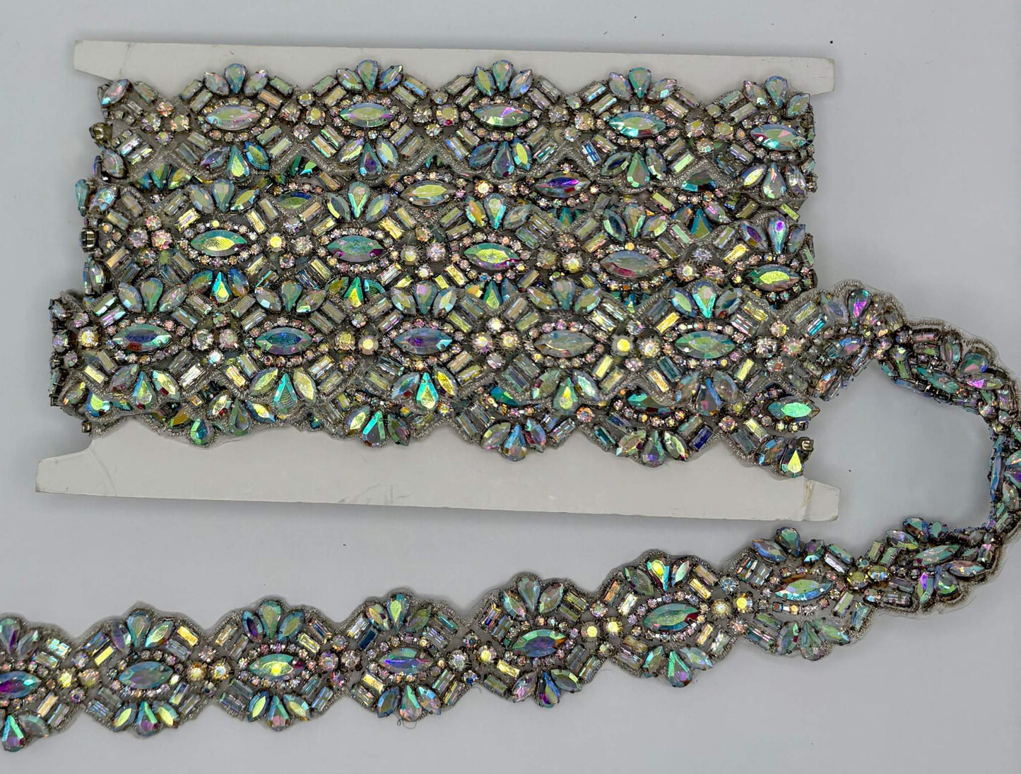 Extravagant rhinestone yardage with AB rhinestones, 1 3/8" wide, ideal for luxury fashion and decor projects.