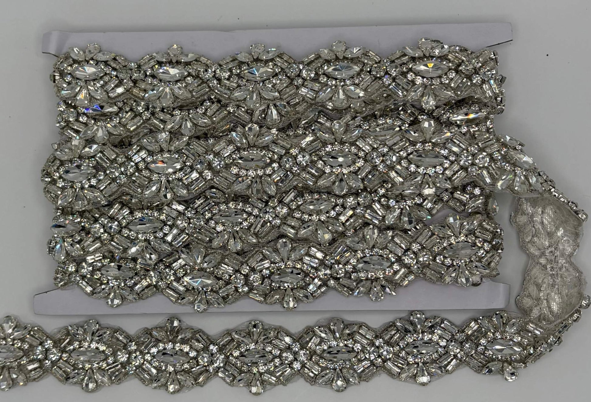 Extravagant 1 3/8" wide rhinestone yardage in clear and AB rhinestones for luxurious sparkle.