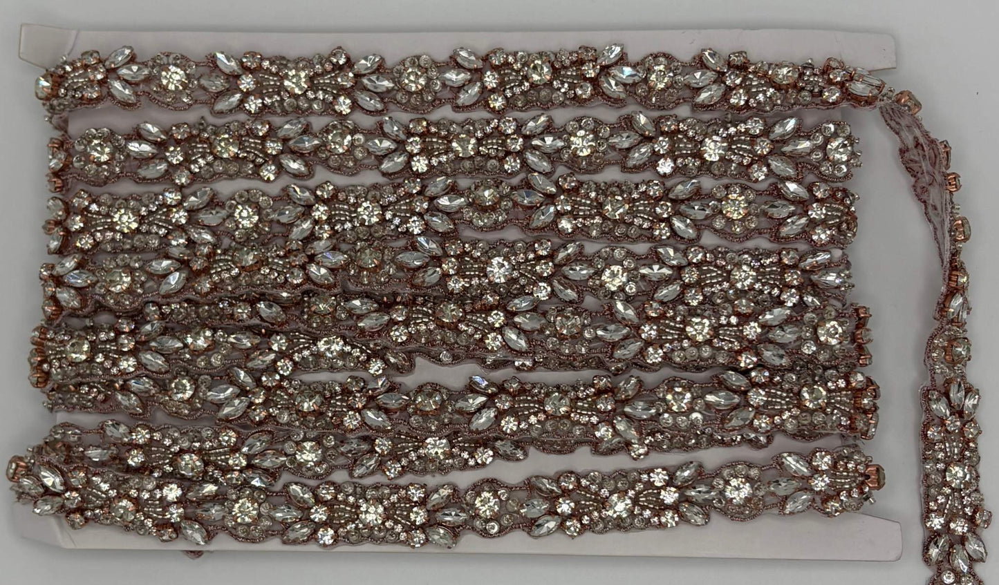Clear rhinestones and glass beads trim with silver and rose gold setting on "Mia's" Yardage.