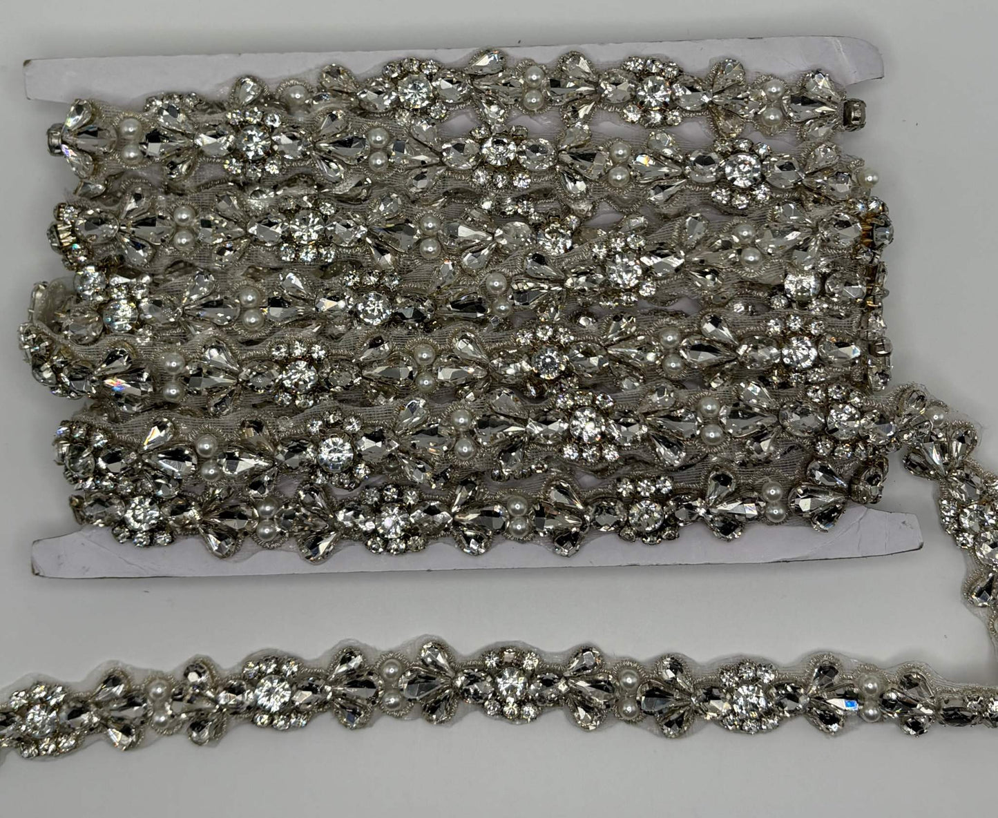 Clear rhinestone yardage with pearl accents, 3/4" width.