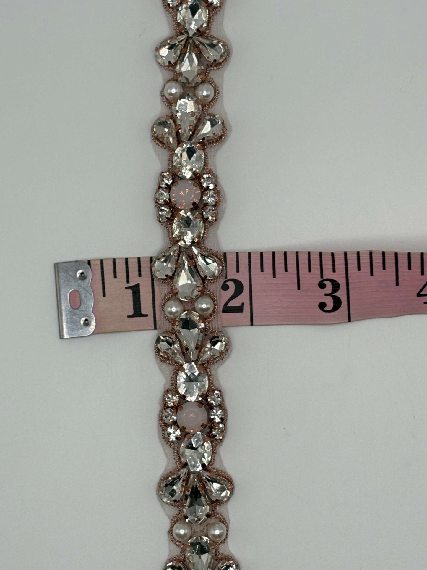 Clear rhinestone yardage with pearl accents, measuring 3/4 inch wide.
