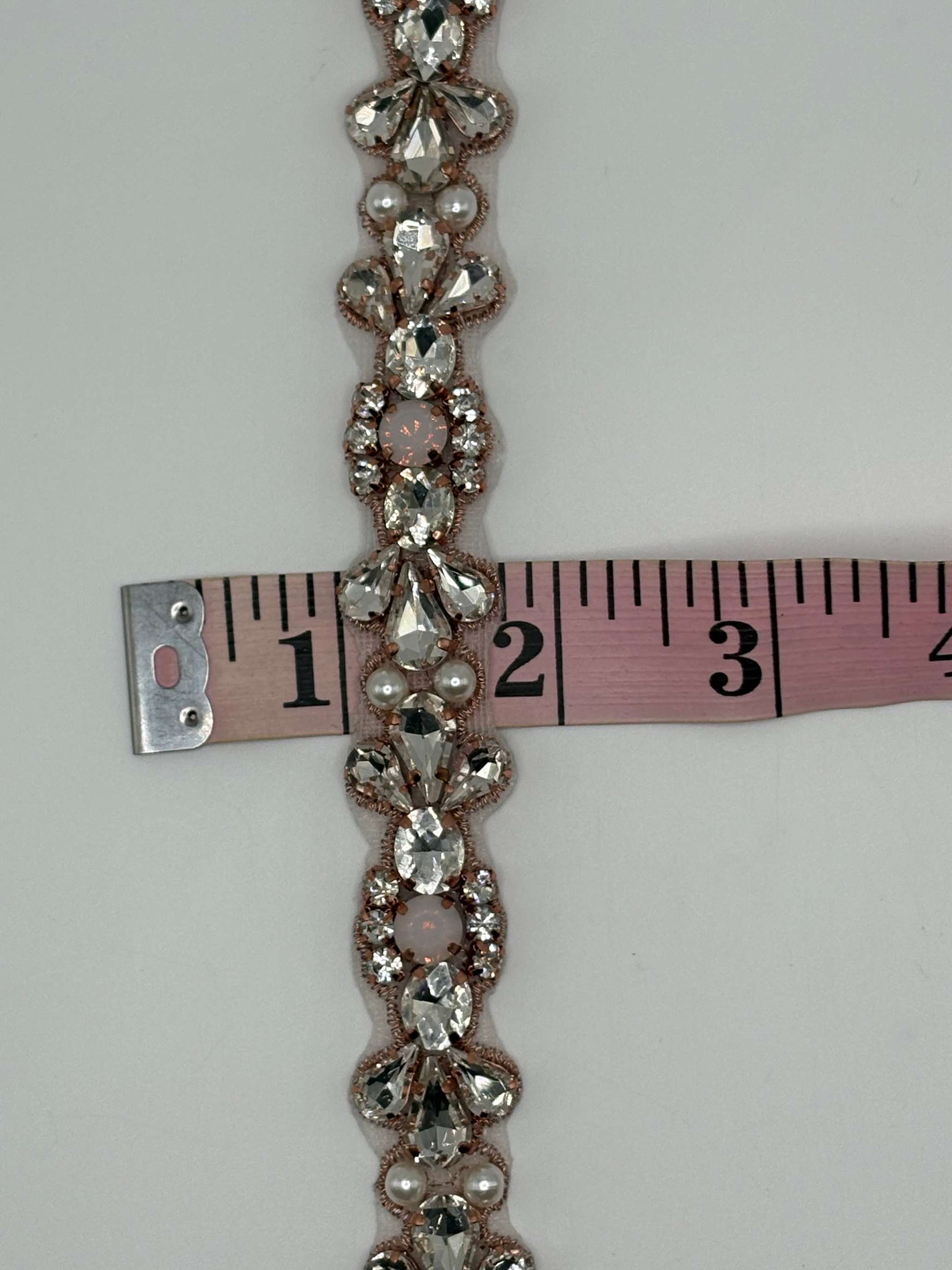 Clear rhinestone yardage with pearl accents, measuring 3/4 inch wide.