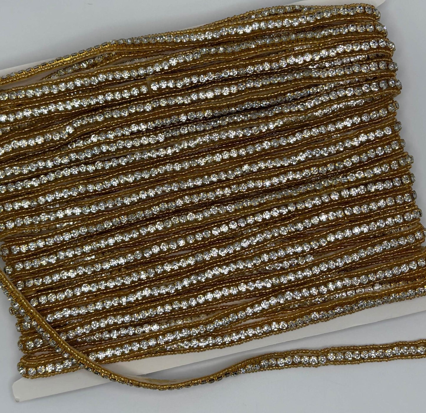 Beaded and rhinestone yardage with small handmade beads, approximately 3/8" wide.