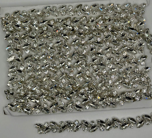 Rhinestone chain yardage with sparkling rhinestones approx. 1/4" wide for versatile embellishments.