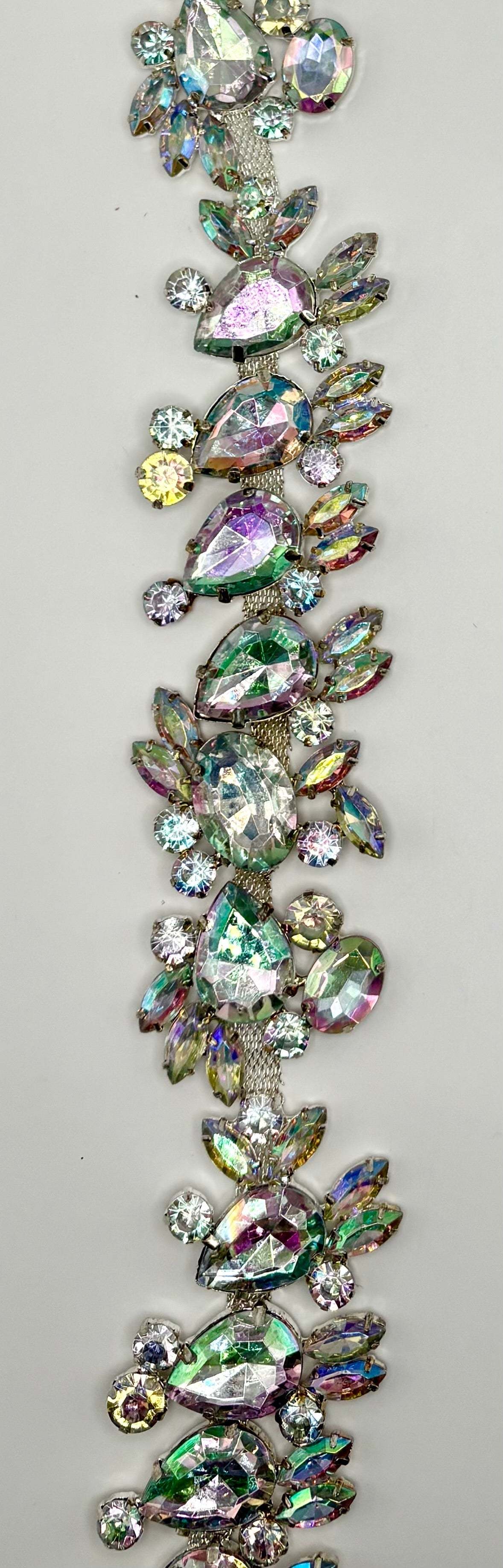 Rhinestone yardage "Evening in Paris" in AB on a silver chain, approximately 1 3/4 inches wide.