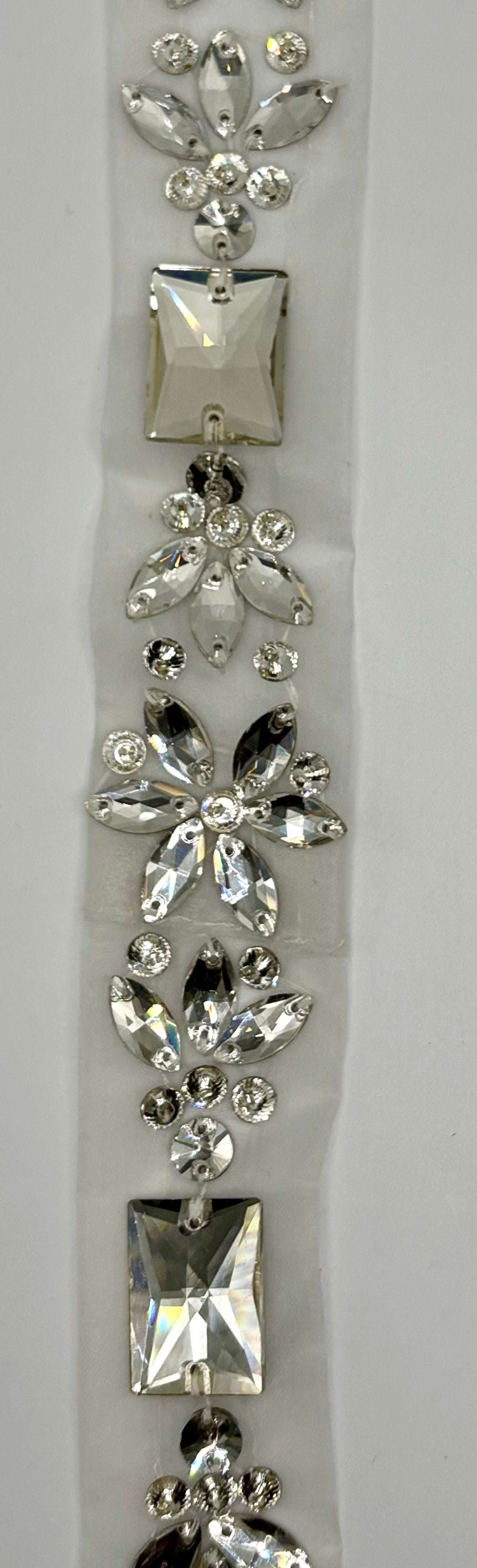 Grandiose Original rhinestone yardage with intricate design on chain backing.