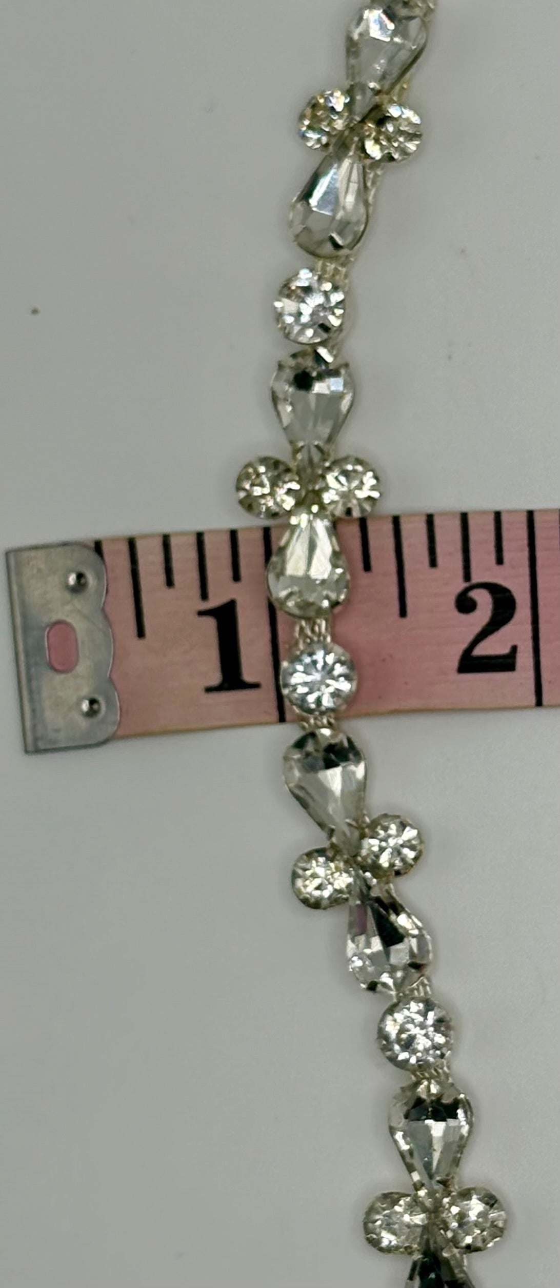 "Cynthia" Rhinestone Yardage on silver chain, approximately 1/2 inch wide.