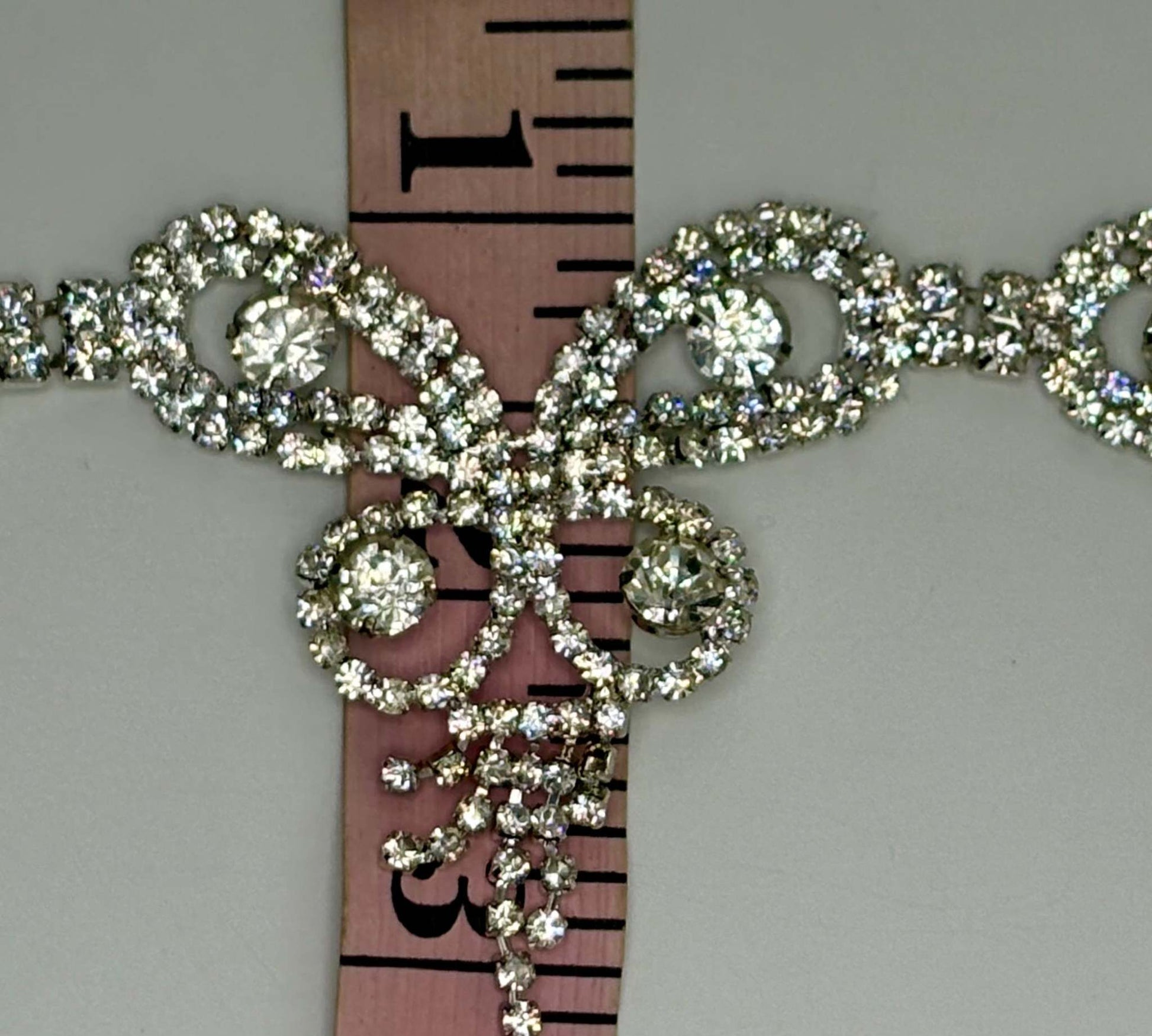 "La Bella" clear crystal rhinestone yardage, approximately 2 inches wide.
