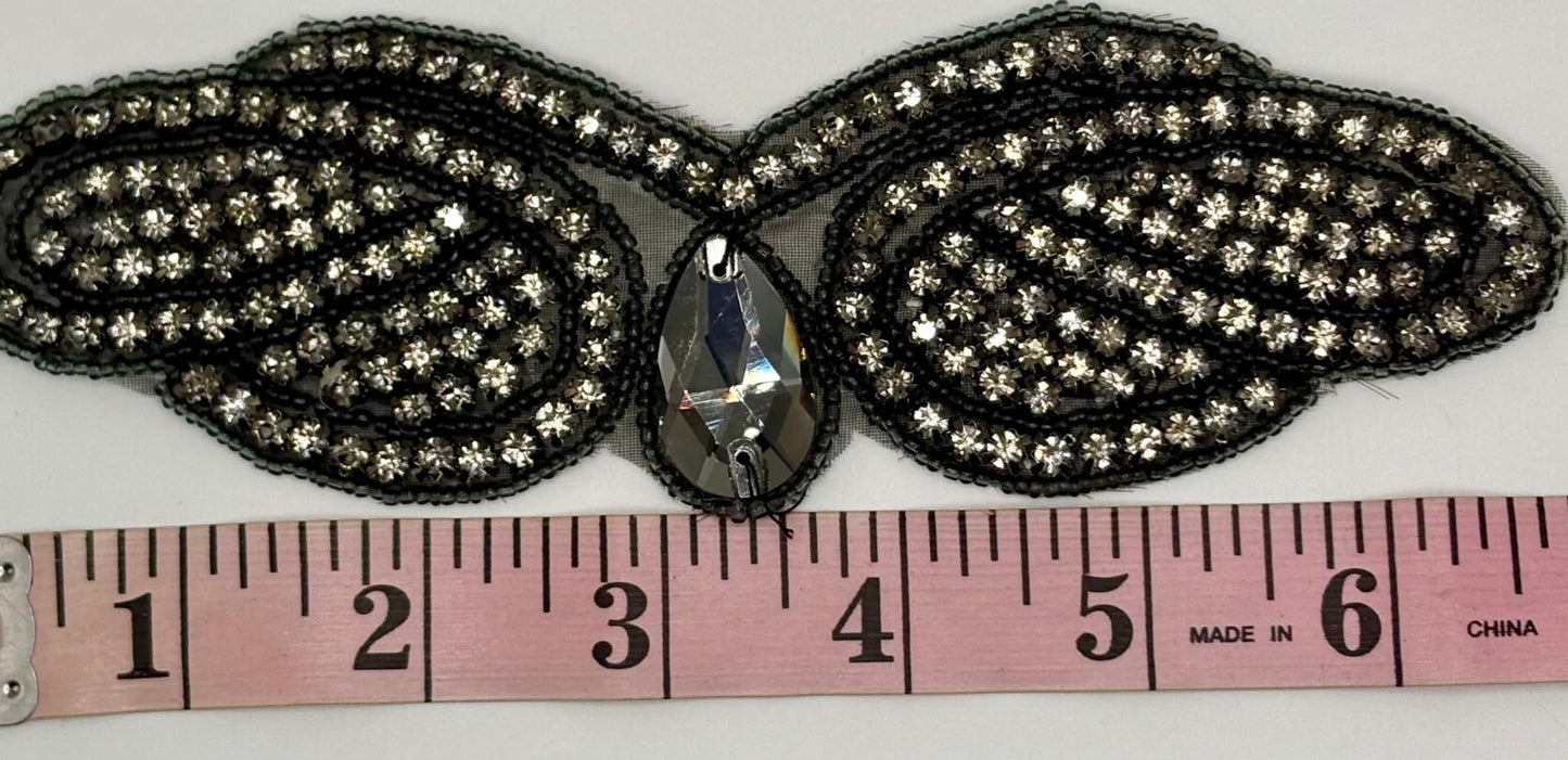 2.5" wide rhinestone romance yardage with measuring tape.