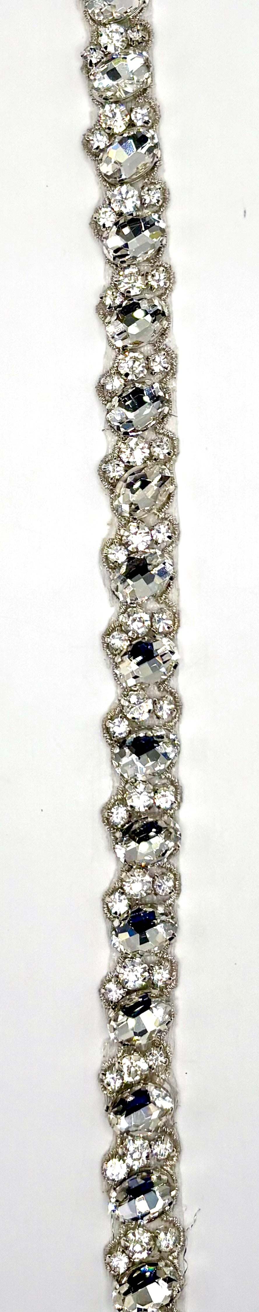 "Annah" Rhinestone Yardage with clear rhinestones on silver trim, approximately 1/2 inch wide.