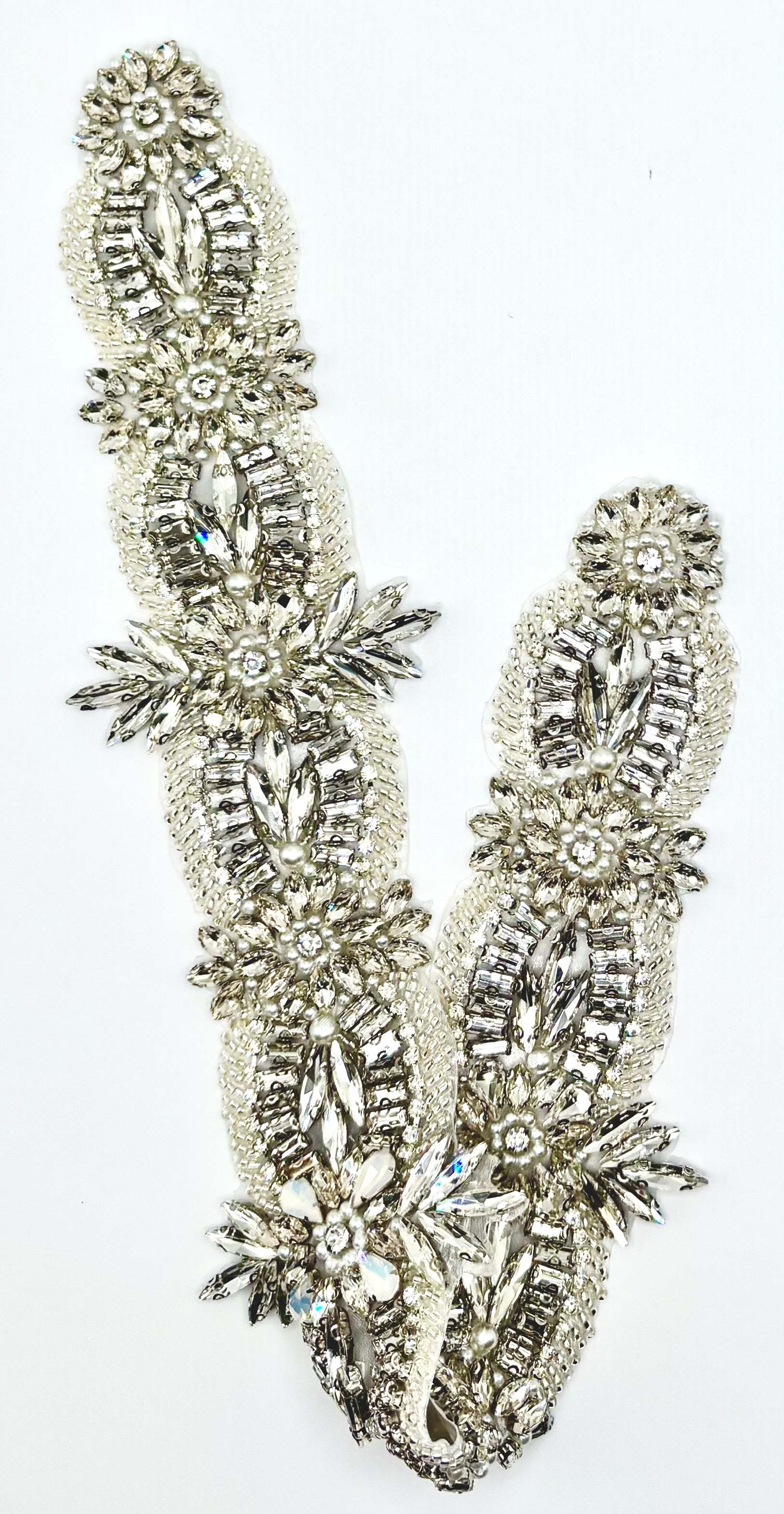 Opal and clear rhinestone bridal belt with pearls and glass beads on silver background.