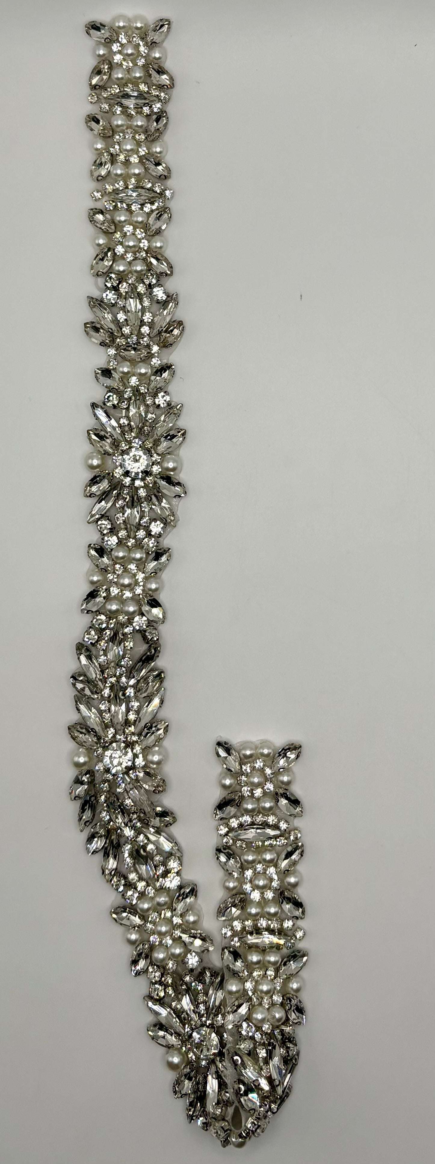 Handmade bridal belt with rhinestones and pearls embellishment.