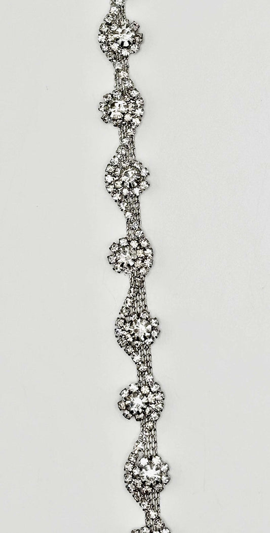 Skylar handmade rhinestone chain yardage with intricate design.