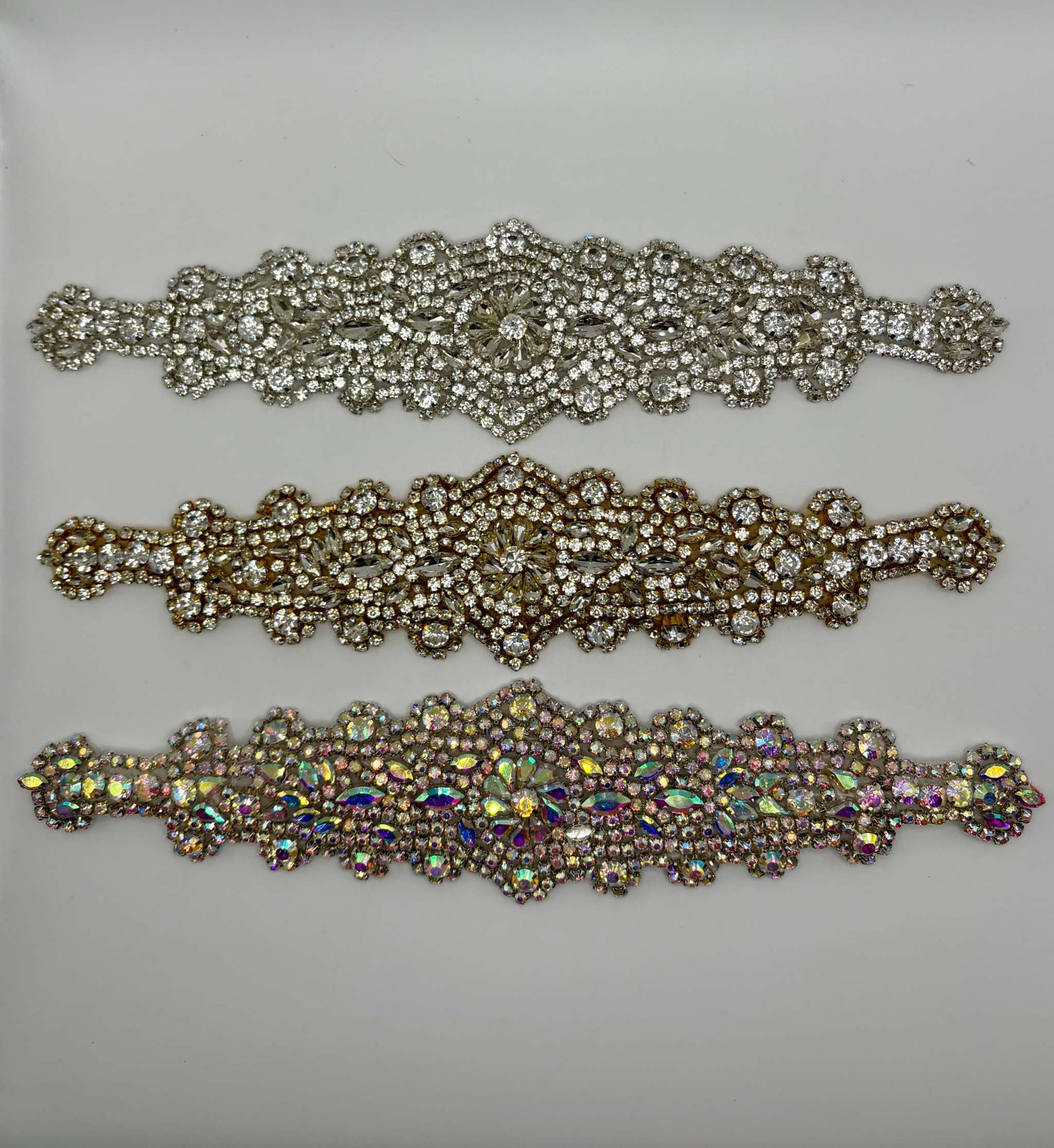 Handmade rhinestone bridal belts in silver, gold, and multicolor designs.