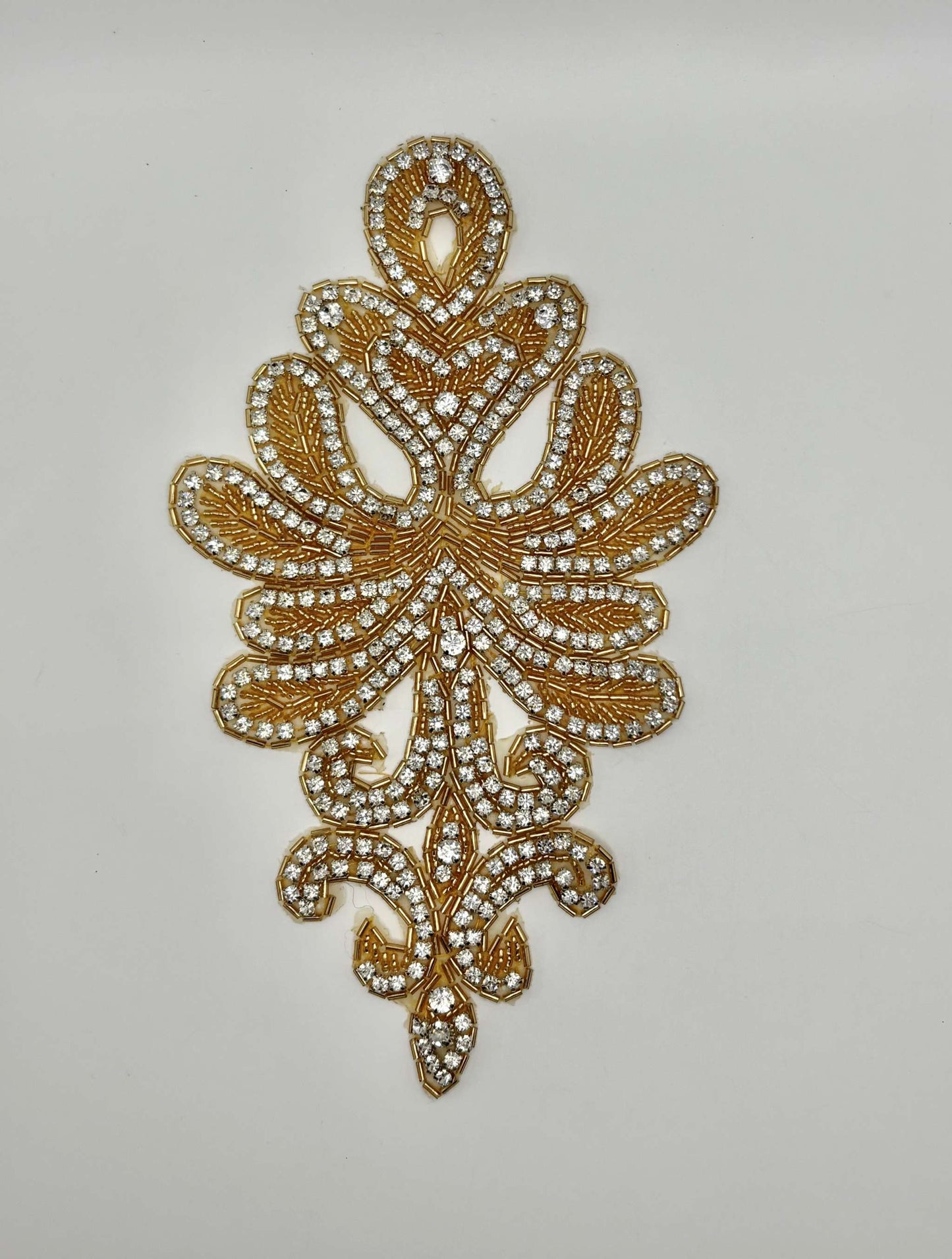 Handmade beaded accent with rhinestones, approximately 9" x 5".