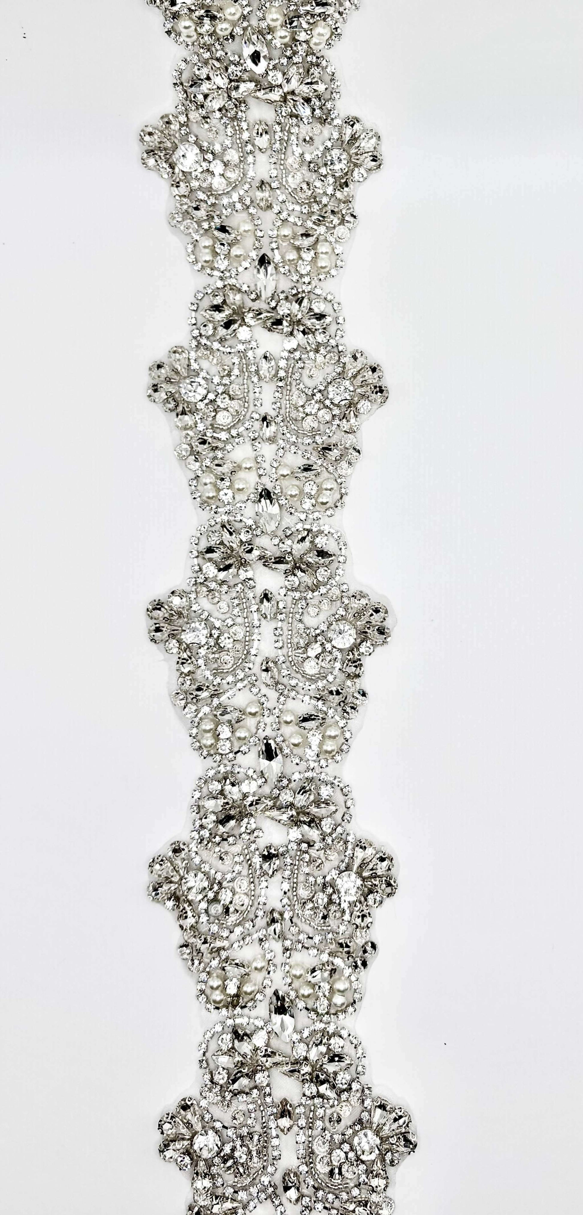 Rhinestone and Pearl Trim displayed featuring intricate rhinestones and pearls on silver settings.