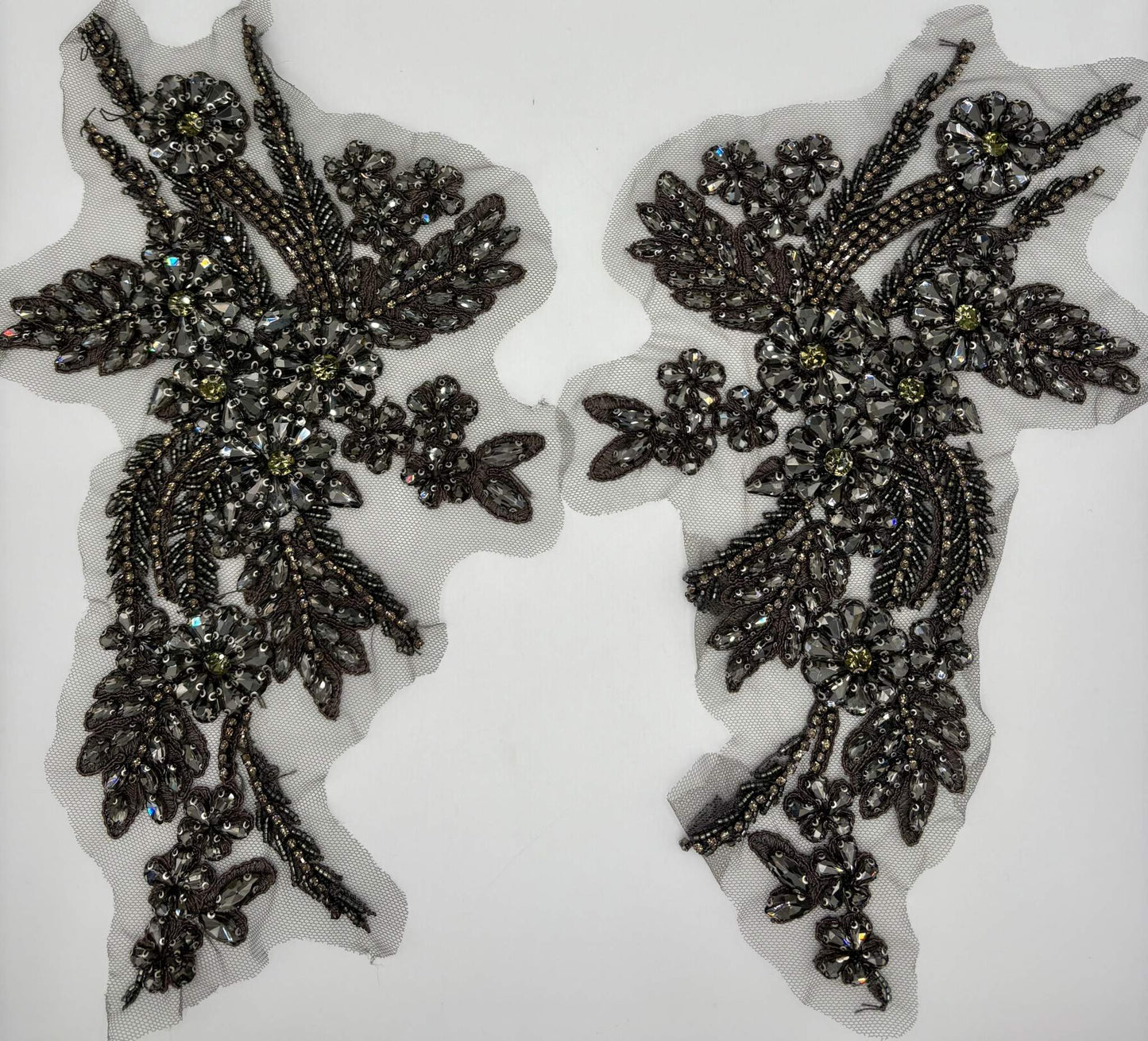 Handmade rhinestone appliqué pair in various colors, measuring 11 inches, for elegant accenting on garments.