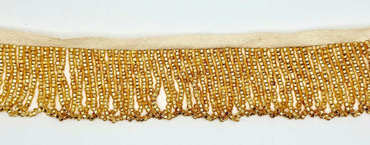 Gold Beaded Looped Fringe Trim featuring delicate glass beads in a luxurious drape, perfect for couture designs.