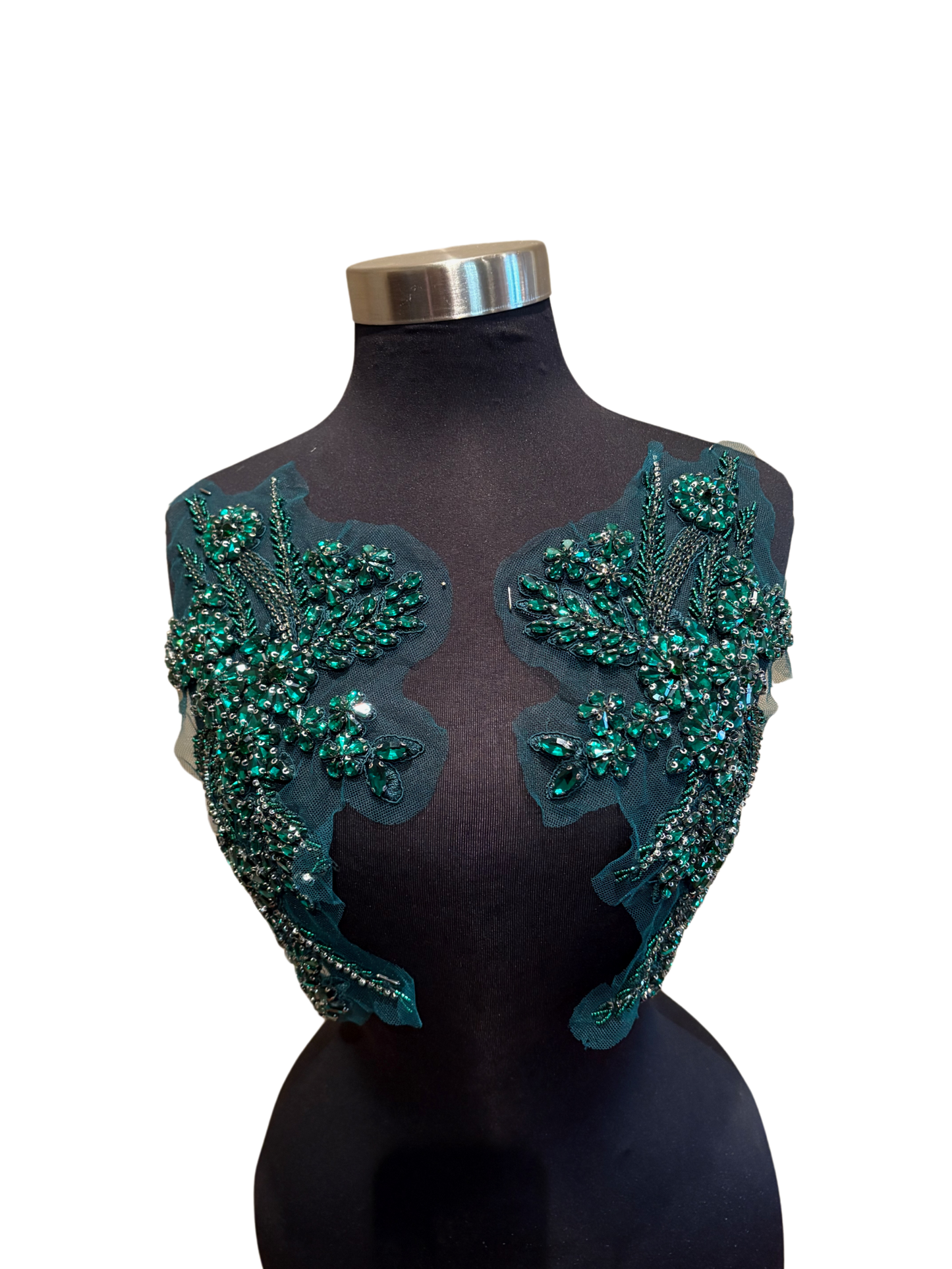 Handmade rhinestone applique pair in vibrant color on mannequin.